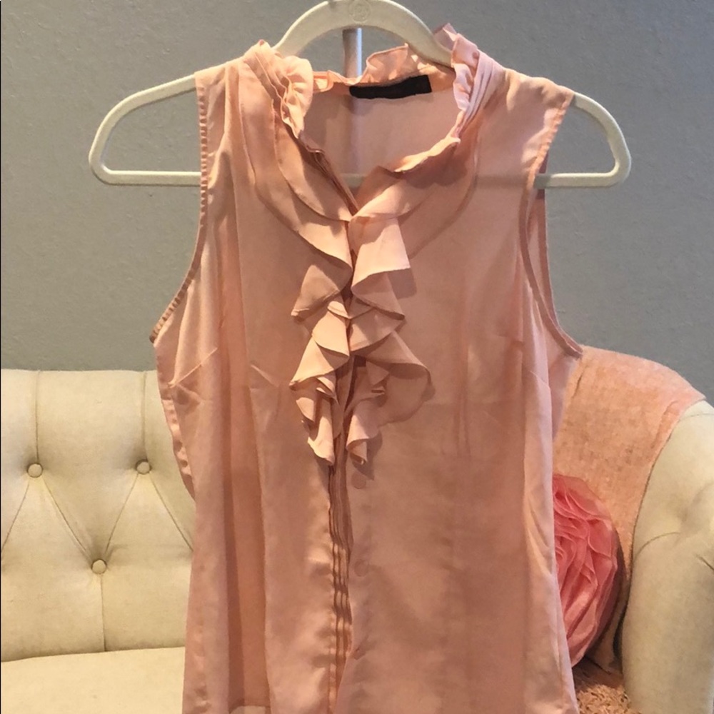 Pink sleeveless blouse